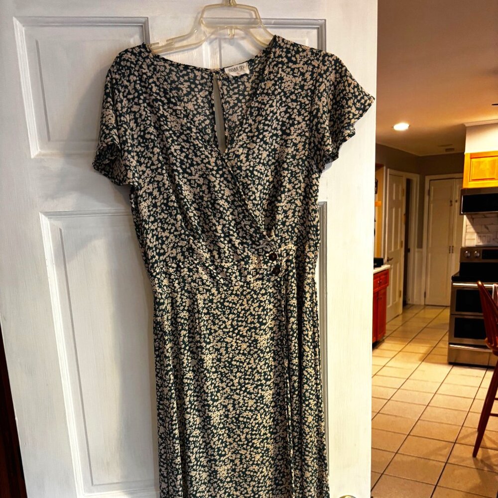 Sienna Sky feminine, retro dress, midi length, white flowers on green background